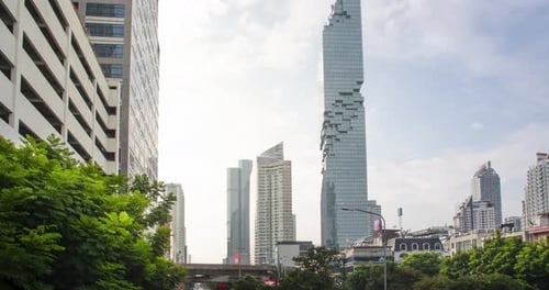 Timelapse street landscape view among the city center of bangkok with some traffic in daytime early