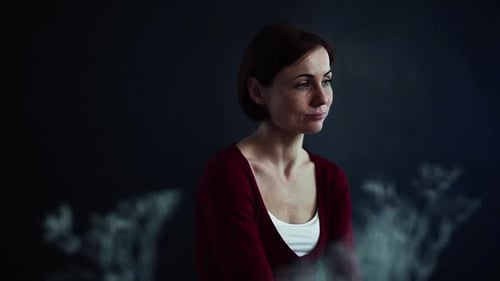 Woman Posing Indoors with thoughtful expression