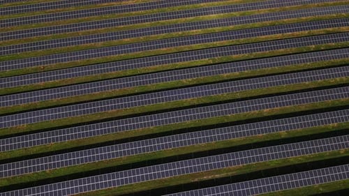 Aerial Top Down View of the Large Power Farm Station with Solar Panels Renewable Energy Located in