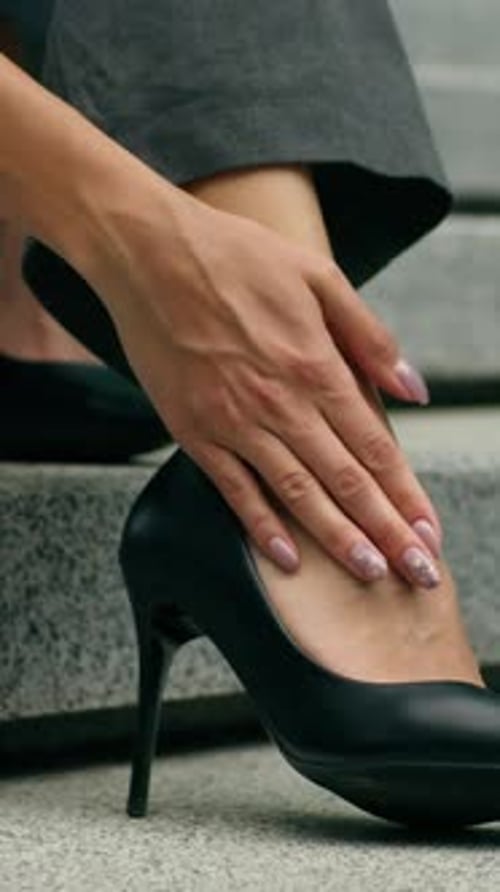 Unrecognizable Stylish African Business Woman Feeling Ankle Pain High Heels Discomfort in City