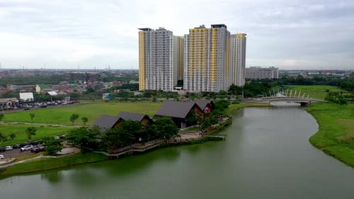 Modern Cityscape with Lake and Towering Buildings