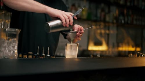Bartender Making Cocktail in Bar