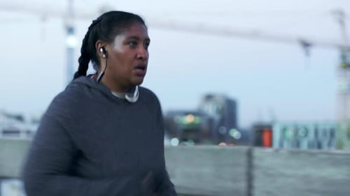 Plus size, black woman and running in urban city with motivation to lose weight