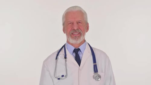 Smiling Senior Doctor in White Coat Close Up