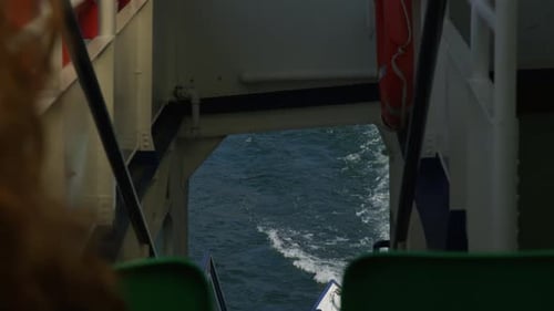 Person's POV Looking On Backwash Of Boat Cruising In The Sea.