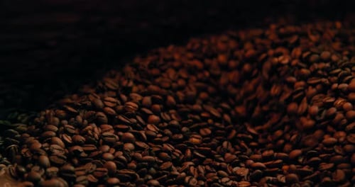 Slow Motion Coffee Beans Mixing In A Coffee Roaster. Close Up Footage.