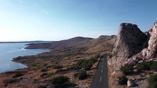 S shaped corner road higher on the hill, near the sea.
