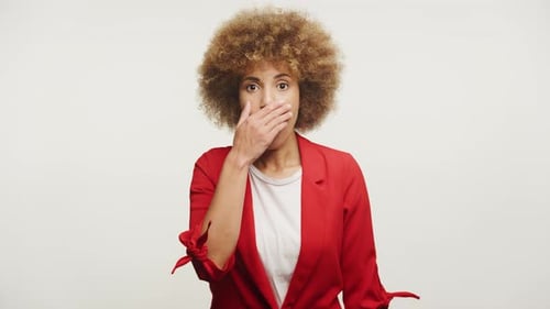 Shocked Woman Covering Mouth with Hand