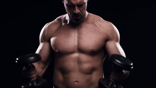 Fit and Sporty Bodybuilder Over Black Background Bodybuilder Training Using Barbell The Concept of