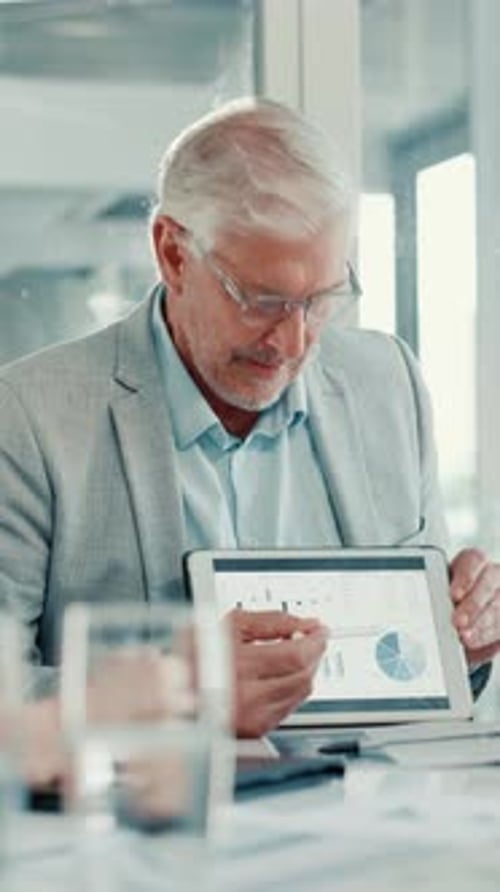 Meeting, tablet screen and businessman in office with statistics, graphs or charts for finance
