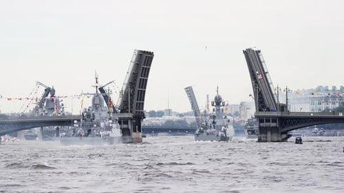 A Lot of Warships Goes Along the Neva River Under Open Bridges at the Time of the Celebration of the