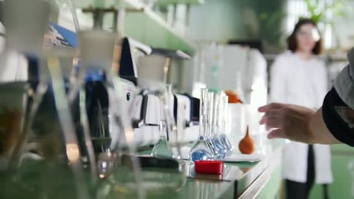 A Woman Working with Flaks in Medical Laboratory