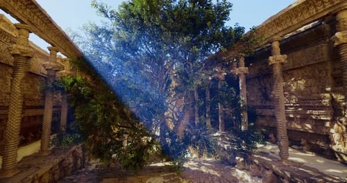 Intricate Ancient Architecture with a Large Tree in a Sunlit Courtyard
