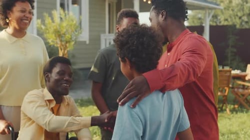 Family and Friends Gathering Joyfully in Suburban Yard