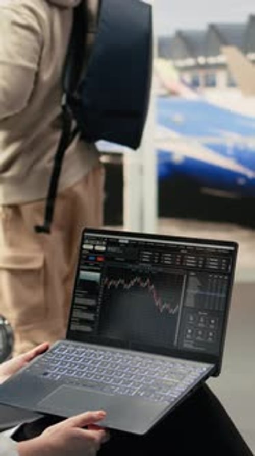 Vertical Video Professional Woman Reviewing Stock Charts and Financial Market Insights