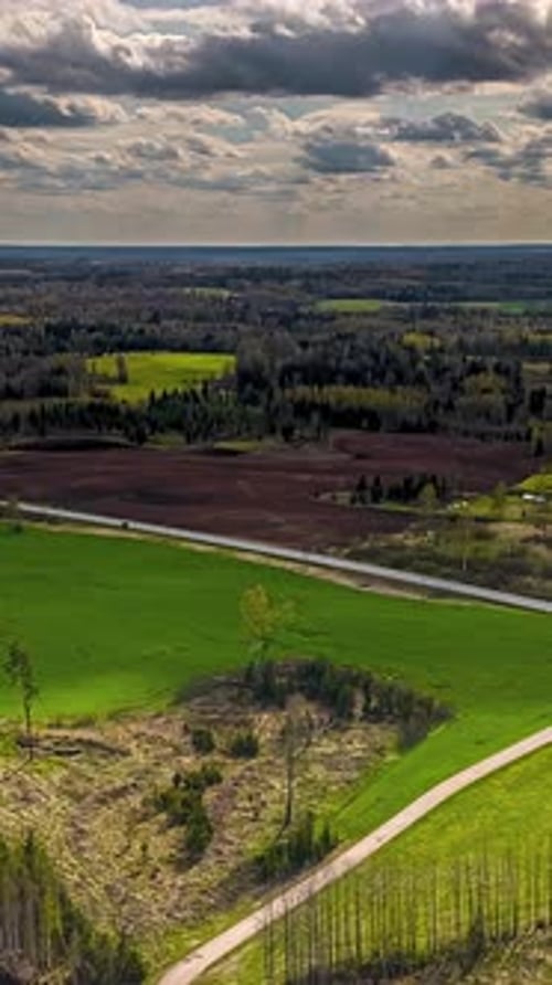 Aerial Timelapse of Scenic Rural Landscape with Dramatic Cloudy Sky