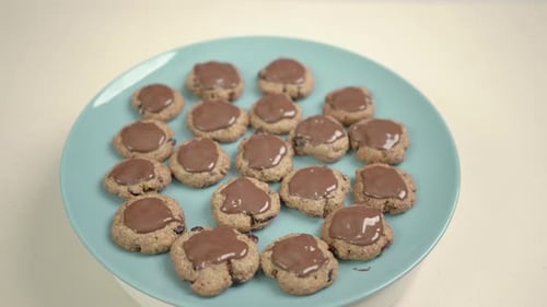 Chocolate Glazed Cookies on a Blue Plate