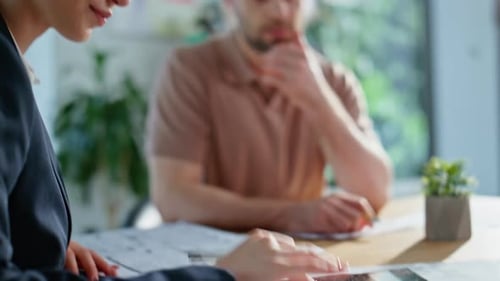 Consultant Making Loan Calculations to Businessman at Corporate Office Closeup