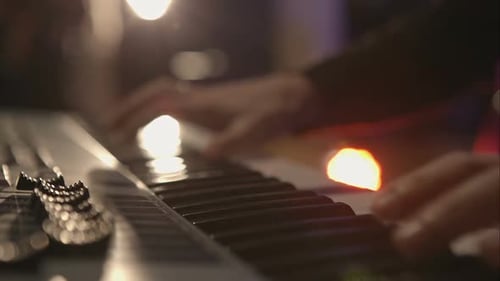 Hands Playing Keyboard in Close Up
