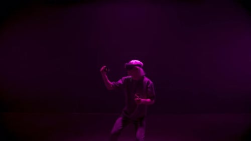 Man Experiencing Virtual Reality with Headset and Controllers