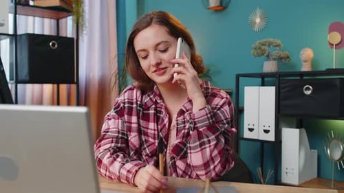 Woman Working at Home Talking on Phone