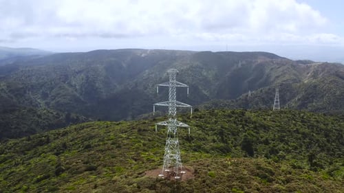 Aerial of electricity tower to transport power through cables in mountains
