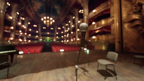 Elegant Microphone on Stage in Ornate Golden Theater