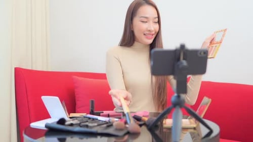 Woman Films Makeup Tutorial for Beauty Blog