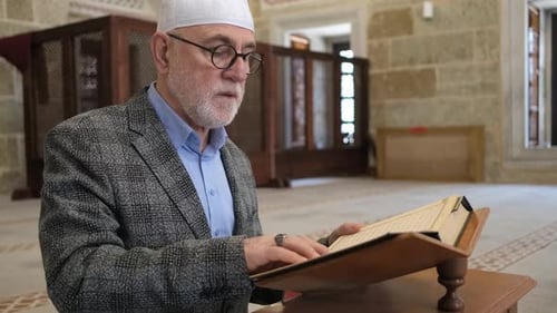 Man Reading Quran