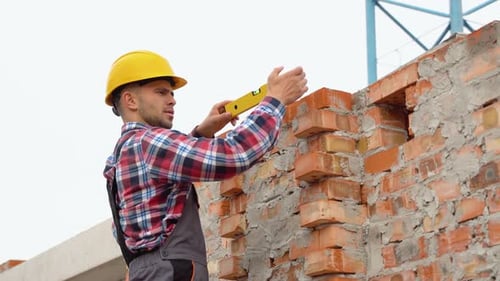 Worker Control Brick Wall Using Level Tool