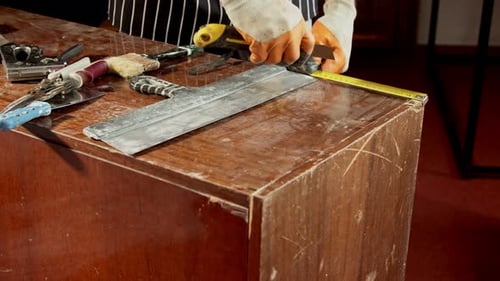 Furniture Restoration Furniture Repairman in a Special Protective Apron in a Working Workshop Works