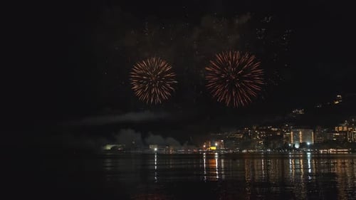 Fireworks with Colorful Lights Over Sea