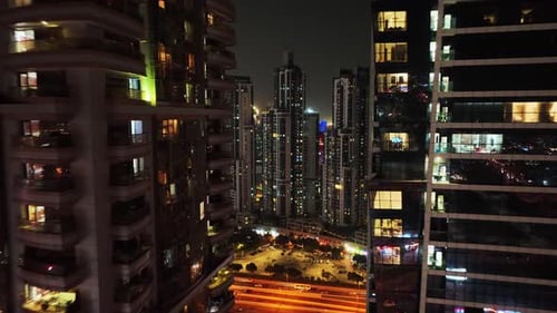 Drone flying through the middle of Dubai Skyscrapers and revealing Dubai Downtown skyline