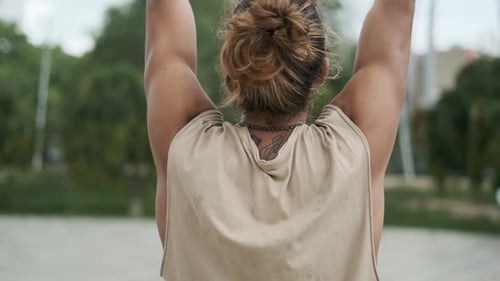 Man Practicing Yoga Meditation While Standing Outdoors in a Park