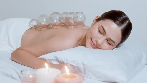 Woman Receiving Cupping Therapy in Spa Setting