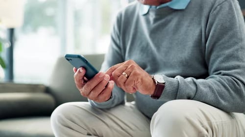 Hand, cellphone and texting on sofa at home for online communication or searching