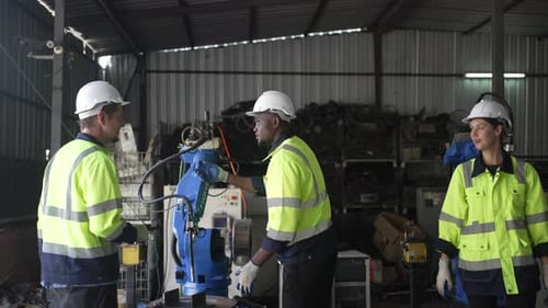 Engineer work at robotic arm factory.