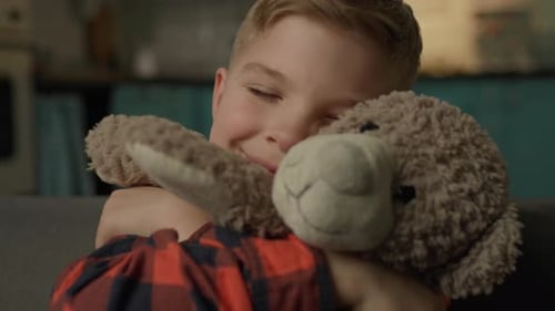 Kid Hugging Teddy Bear Close Up Adorable Child Holding Lovely Toy in Hands Sitting at Home