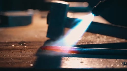 Heating Metal Bar with Torch Flame
