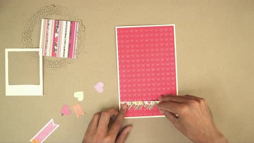 Hands Creating a Decorative Card