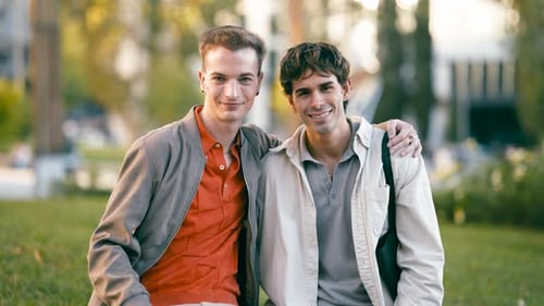 Happy Gay Couple Smiling and Posing for Camera Together
