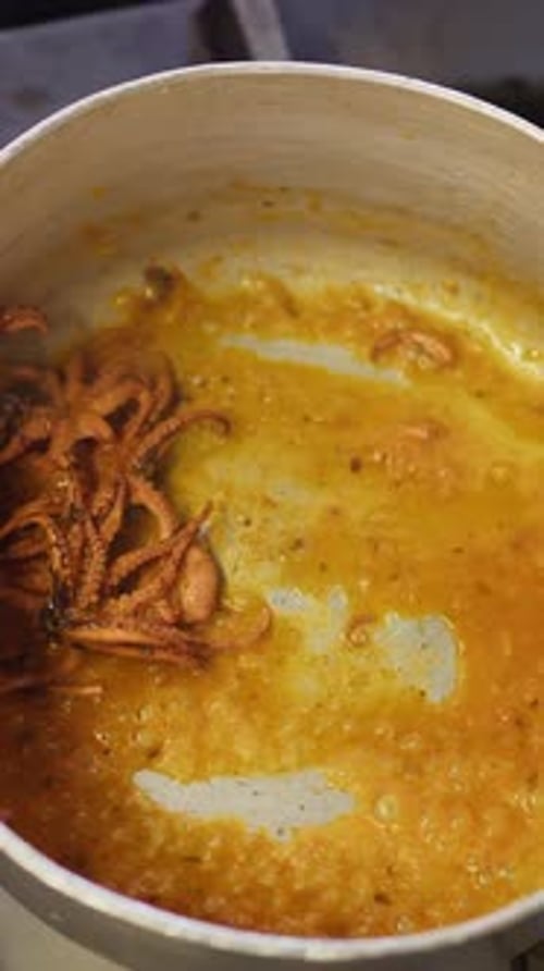 Saucepan With Octopus Cooking In The Restaurant