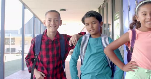 Diverse students pose confidently at school