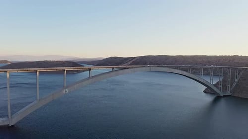Drone shot of the bridge and ocean in the sunset 4