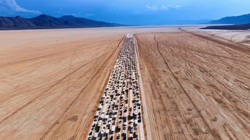 Footage above the road filled with hundreds of cars and campervans.
