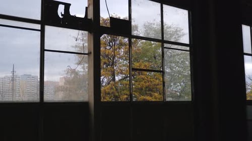 The Wall of an Old Abandoned Factory with Large Broken Windows