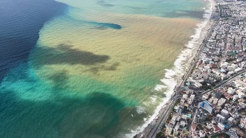 Aerial Video Polluted Sea Water Near Coastal City Drone View
