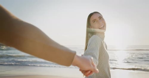Beach, sunset and couple holding hands walking for love, relaxing and commitment in nature
