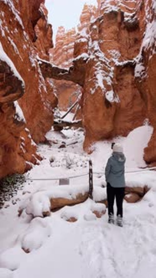 Woman Views Snow in Bryce Canyon National Park