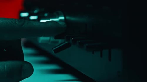 Finger Triggering Buttons Recorder in Dim Studio Closeup Macro View Man Hand